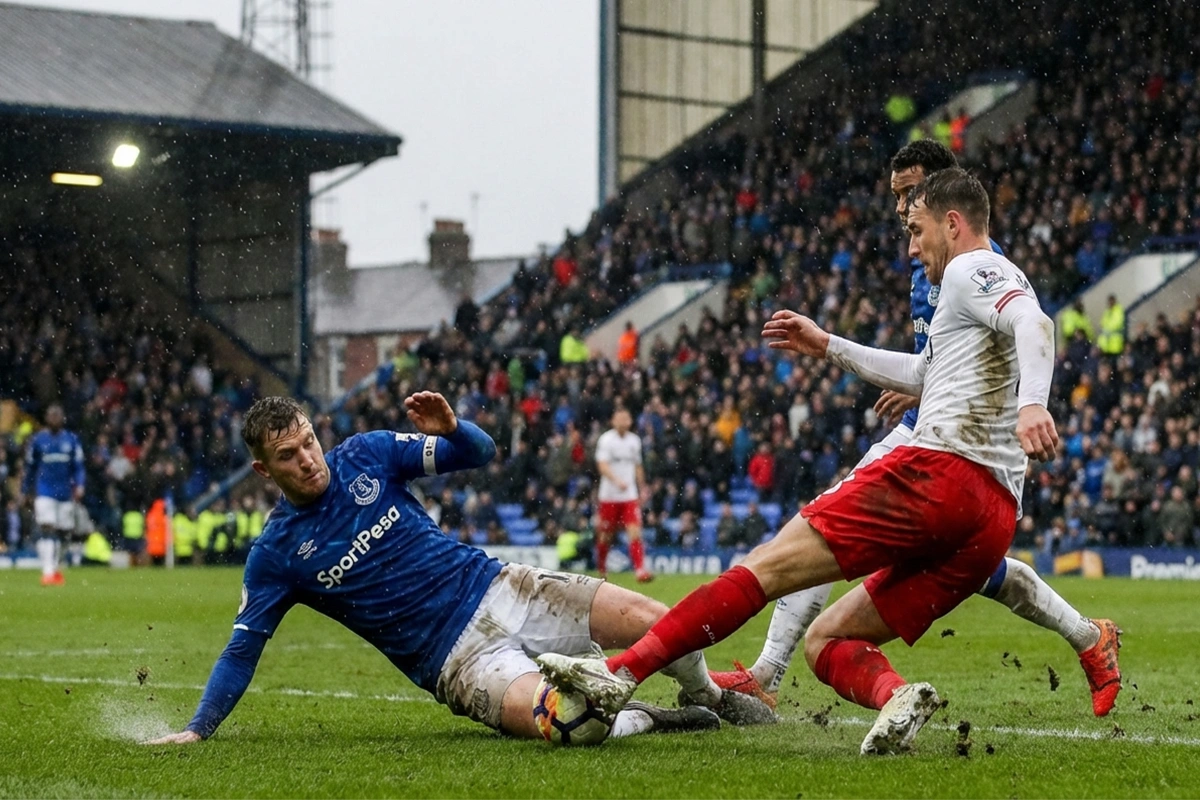 Partido intenso de Premier League con jugadores en acci&oacute;n bajo la lluvia